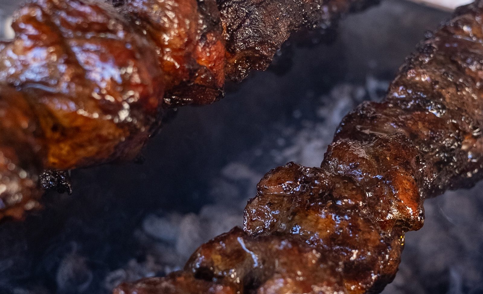 Souvlaki cooking on the charcoal grill