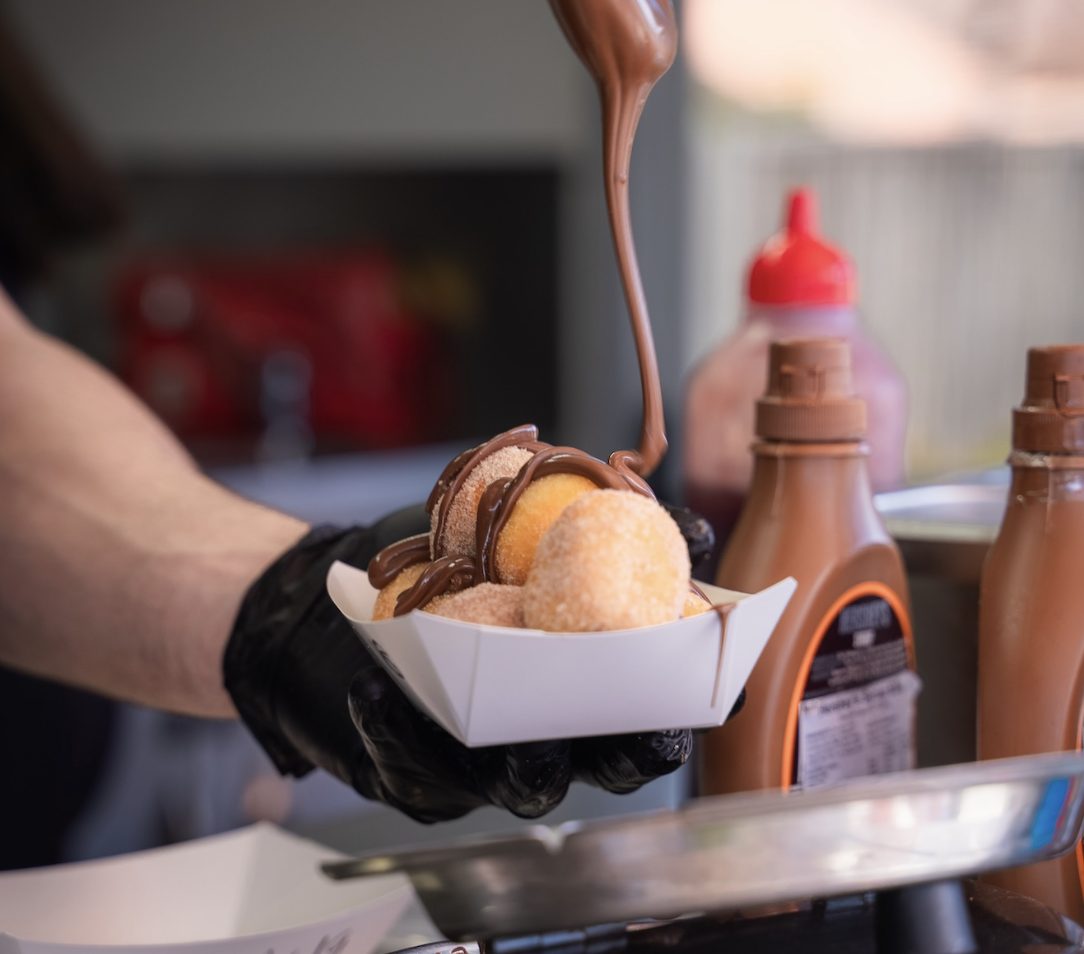 Loukoumades drizzled with chocolate